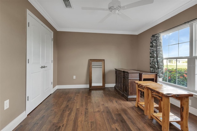 dining area featuring ceiling fan, ornamental molding, and dark hardwood / wood-style floors