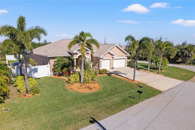 ranch-style home with a garage and a front lawn