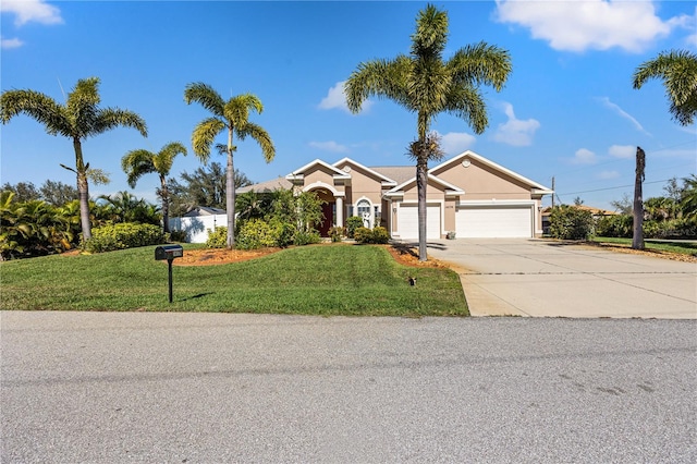 single story home featuring a garage and a front lawn