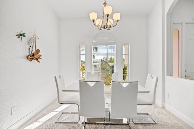 dining space featuring an inviting chandelier