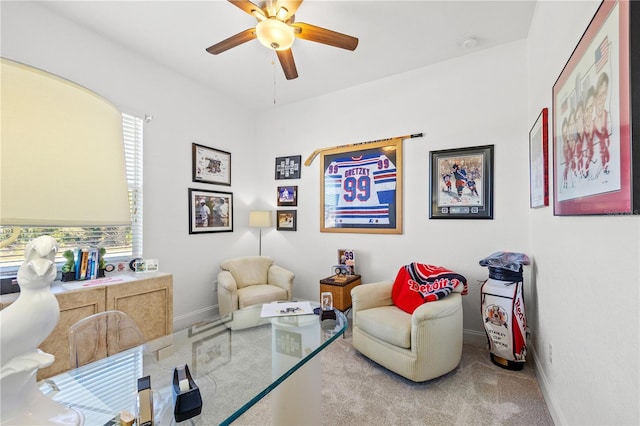 living area with ceiling fan