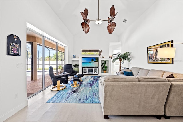 living room with high vaulted ceiling and ceiling fan