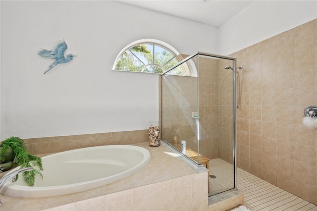 bathroom with shower with separate bathtub