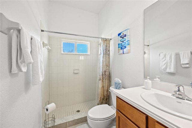 bathroom with walk in shower, toilet, and vanity