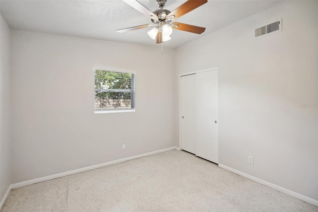 1642 Banyan Dr, Venice, FL 34293 - spare room featuring speckled floor, a ceiling fan, visible vents, and baseboards