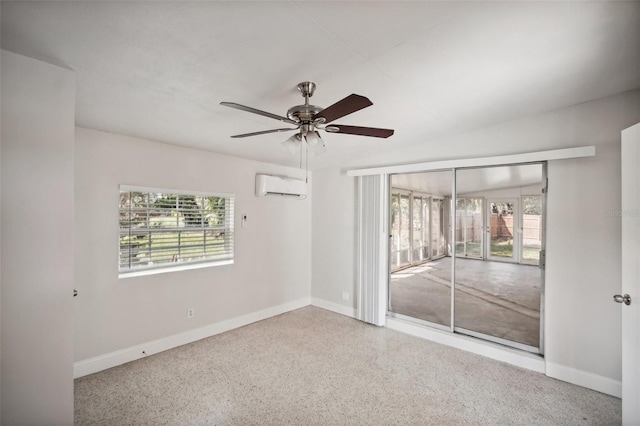 1642 Banyan Dr, Venice, FL 34293 - unfurnished bedroom with access to exterior, speckled floor, a wall unit AC, and multiple windows