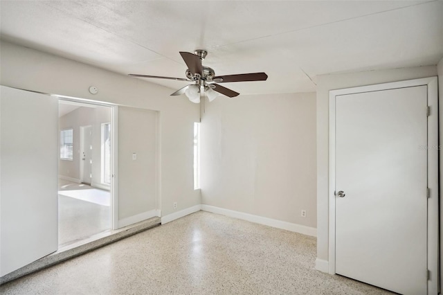 1642 Banyan Dr, Venice, FL 34293 - spare room featuring a ceiling fan, baseboards, and speckled floor