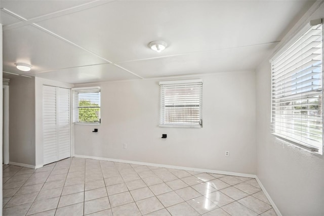 1642 Banyan Dr, Venice, FL 34293 - spare room featuring baseboards and light tile patterned floors