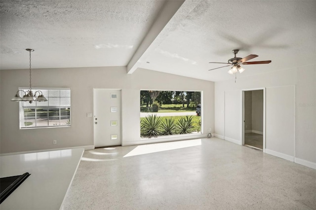 1642 Banyan Dr, Venice, FL 34293 - unfurnished living room featuring baseboards, a textured ceiling, and speckled floor