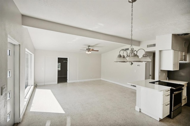 kitchen with ceiling fan with notable chandelier, a textured ceiling, white cabinets, decorative light fixtures, and stainless steel electric range oven