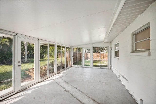 unfurnished sunroom with vaulted ceiling