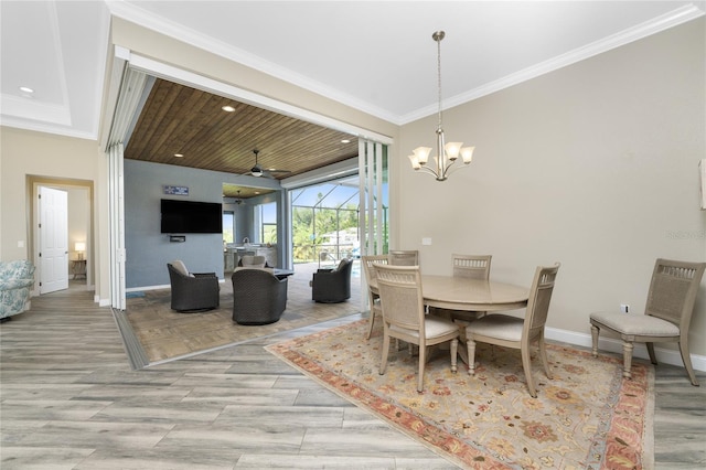 dining room featuring ceiling fan with notable chandelier, ornamental molding, and light hardwood / wood-style floors