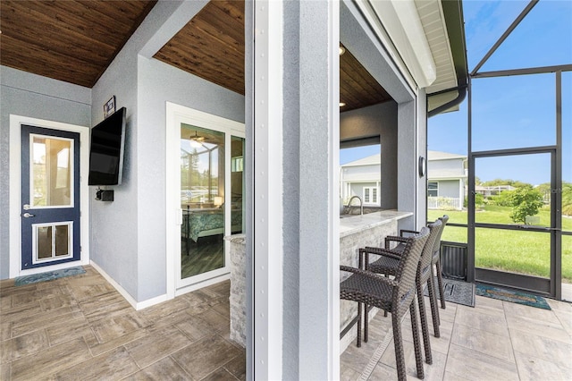 sunroom with wooden ceiling