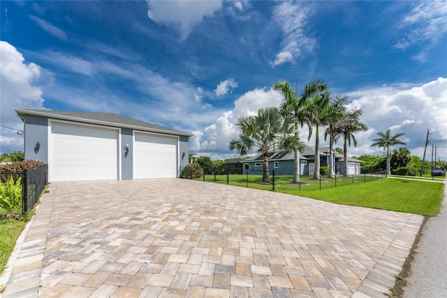 garage featuring a yard