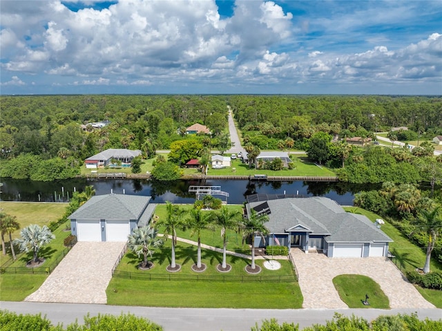 birds eye view of property with a water view