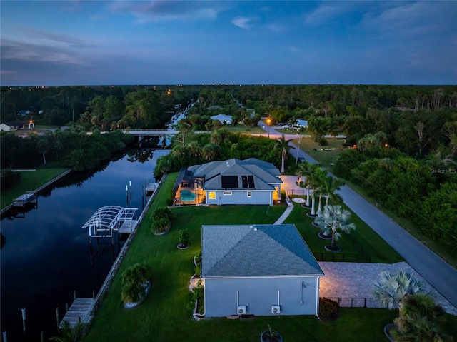 aerial view at dusk with a water view