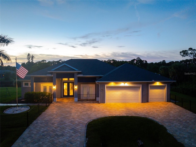 view of front of house featuring french doors and a garage