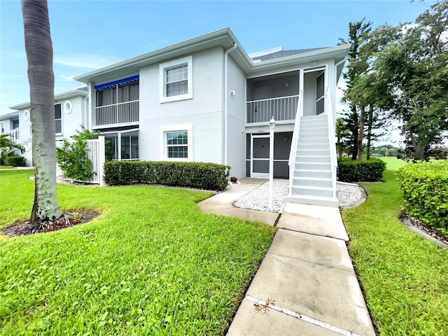 view of front of home with a front lawn