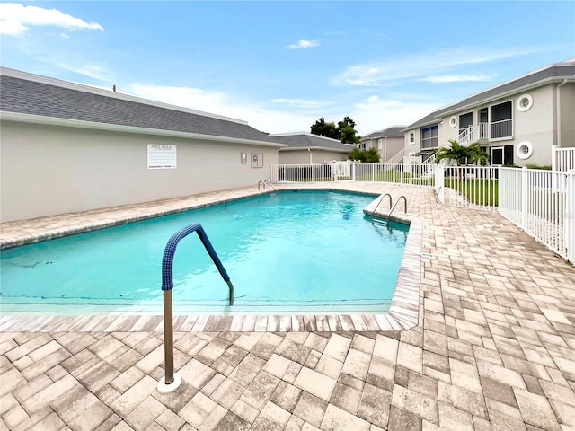 view of swimming pool with a patio area