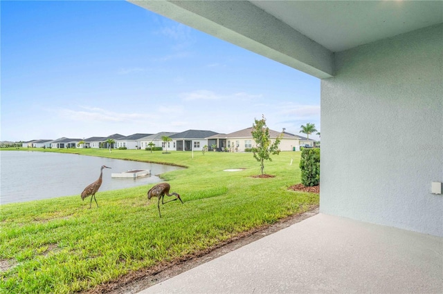 exterior space featuring a water view and a residential view