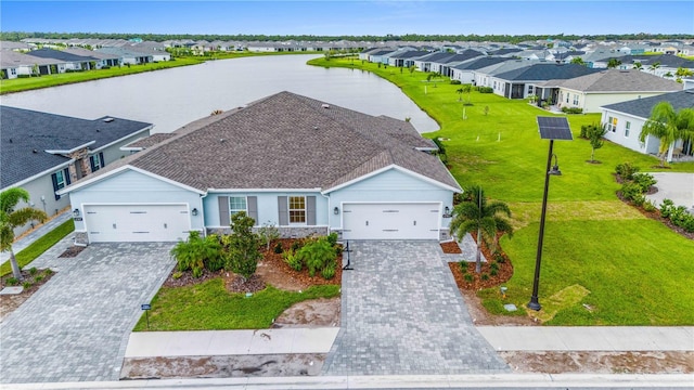 aerial view featuring a water view and a residential view