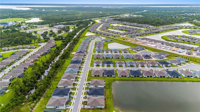 bird's eye view featuring a water view and a residential view