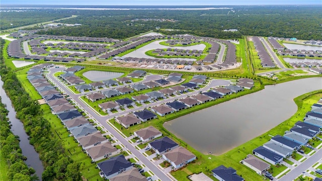 bird's eye view with a water view and a residential view