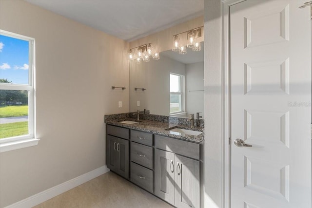 bathroom with vanity and tile patterned flooring