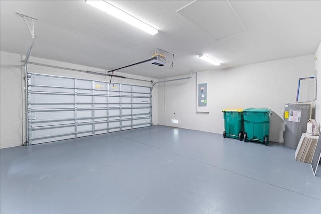 garage with a garage door opener and electric panel