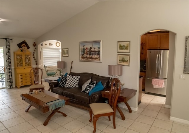 tiled living room with lofted ceiling