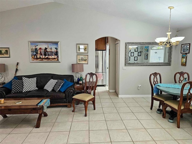 living room featuring light tile patterned floors, vaulted ceiling, and a notable chandelier