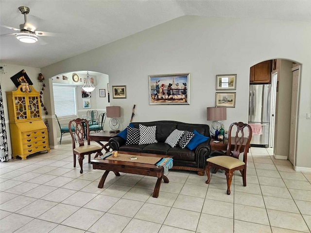 tiled living room featuring lofted ceiling and ceiling fan