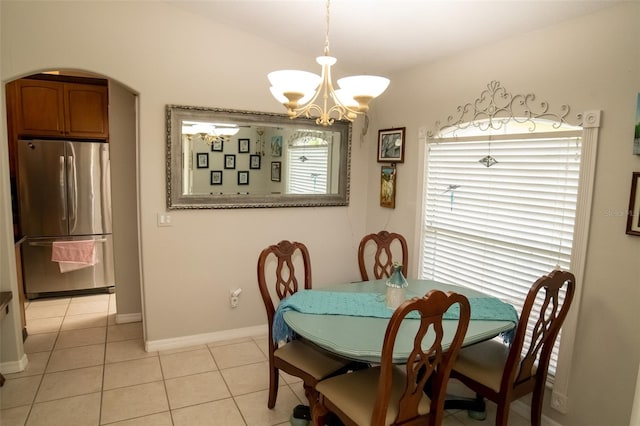 dining space featuring a chandelier, light tile patterned floors, and plenty of natural light