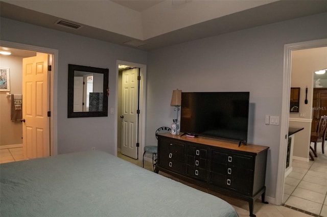 bedroom with light tile patterned floors