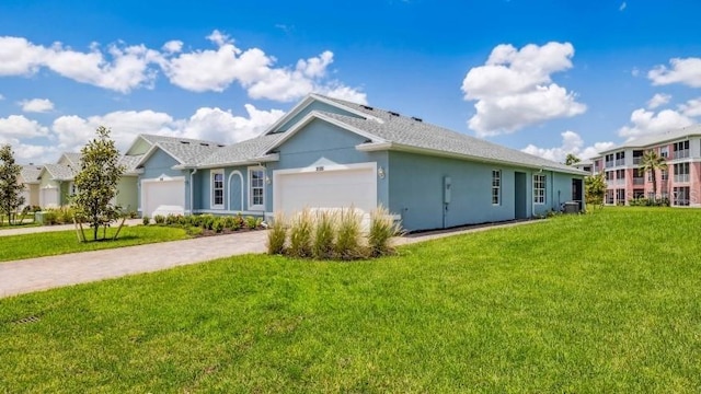 view of side of home featuring a garage and a yard