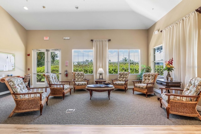 sunroom featuring lofted ceiling