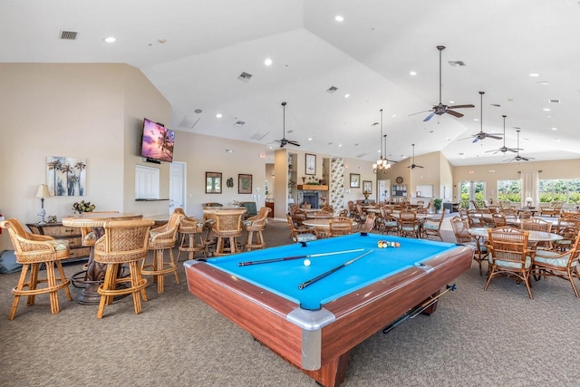 rec room with billiards, a fireplace, high vaulted ceiling, and carpet