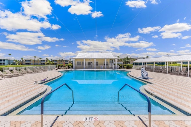 view of swimming pool with a patio