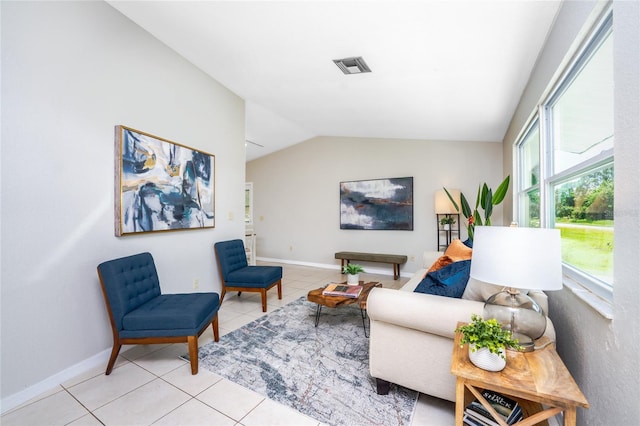 living room featuring light tile patterned floors and vaulted ceiling