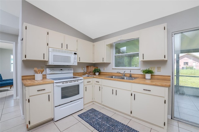 kitchen with white cabinetry, white appliances, lofted ceiling, a healthy amount of sunlight, and sink