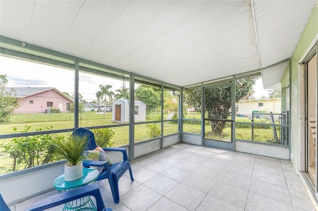 sunroom / solarium with vaulted ceiling