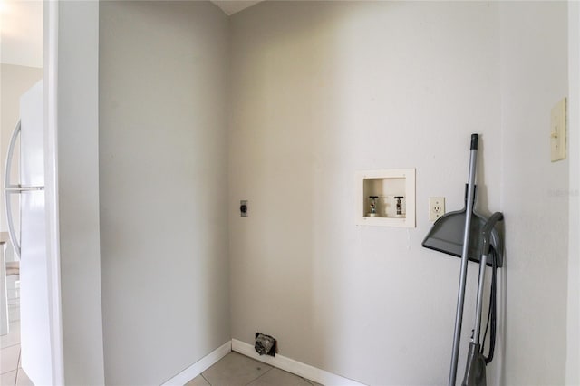 clothes washing area featuring washer hookup, light tile patterned floors, and electric dryer hookup