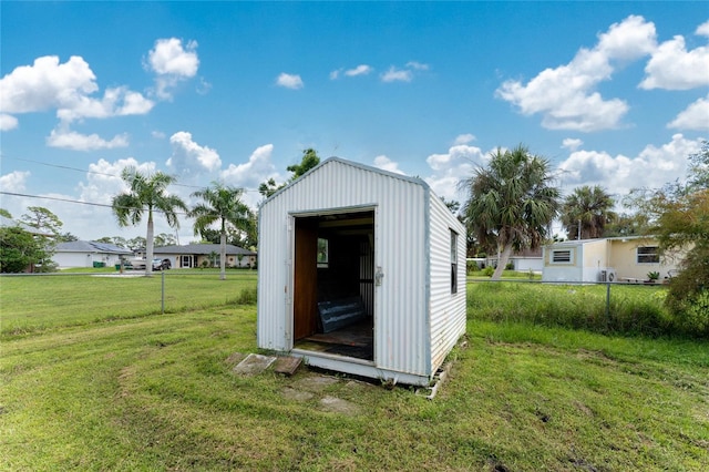 view of outdoor structure with a yard