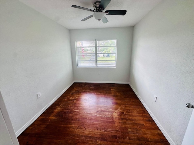 unfurnished room featuring ceiling fan, baseboards, and wood finished floors