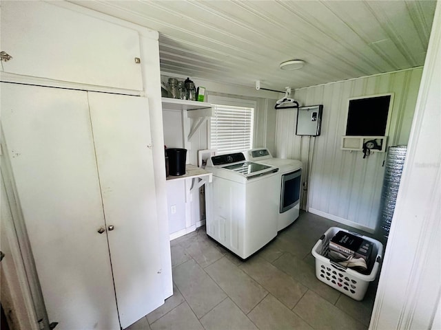 washroom featuring laundry area, washer and dryer, and tile patterned floors