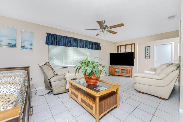 living room featuring ceiling fan and light tile patterned floors