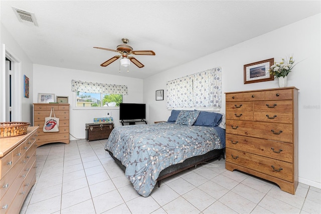 bedroom featuring ceiling fan and light tile patterned floors