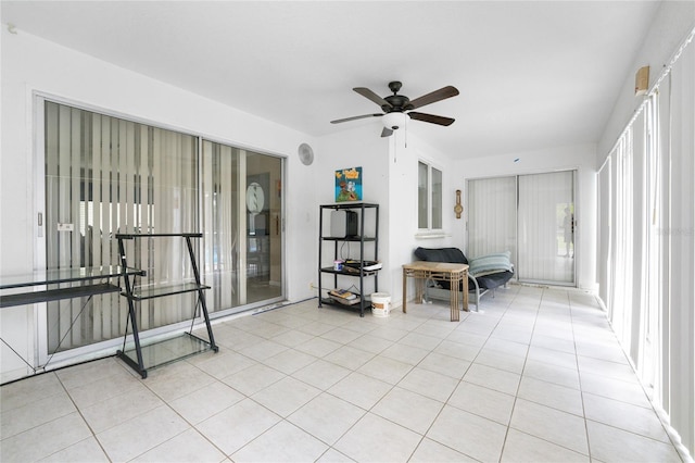 interior space with ceiling fan and light tile patterned floors