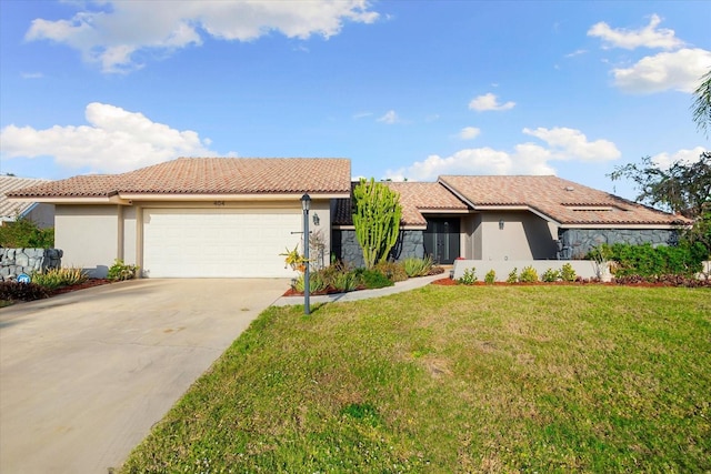 view of front of home with a garage and a front yard