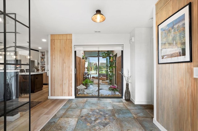 foyer with dark hardwood / wood-style flooring